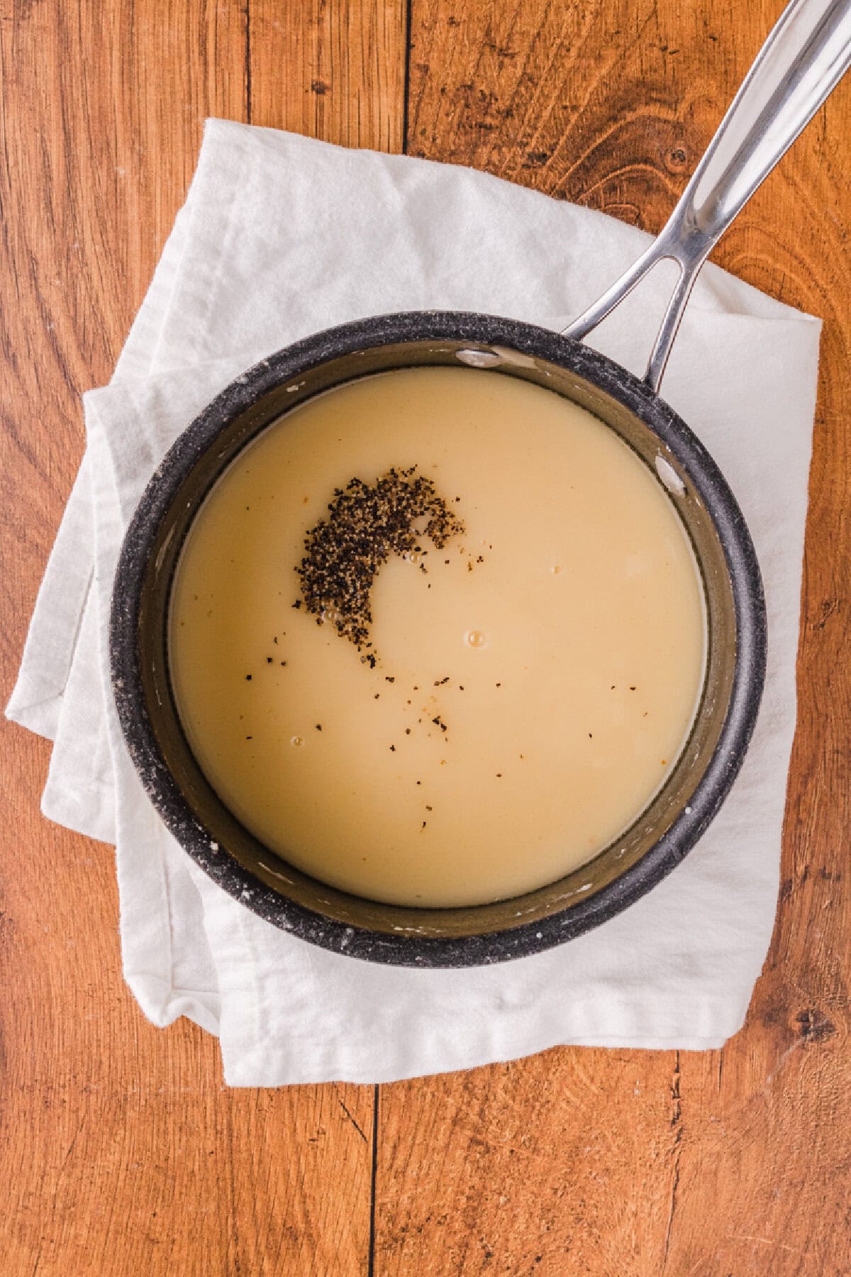 black pepper added to homemade gravy to season.