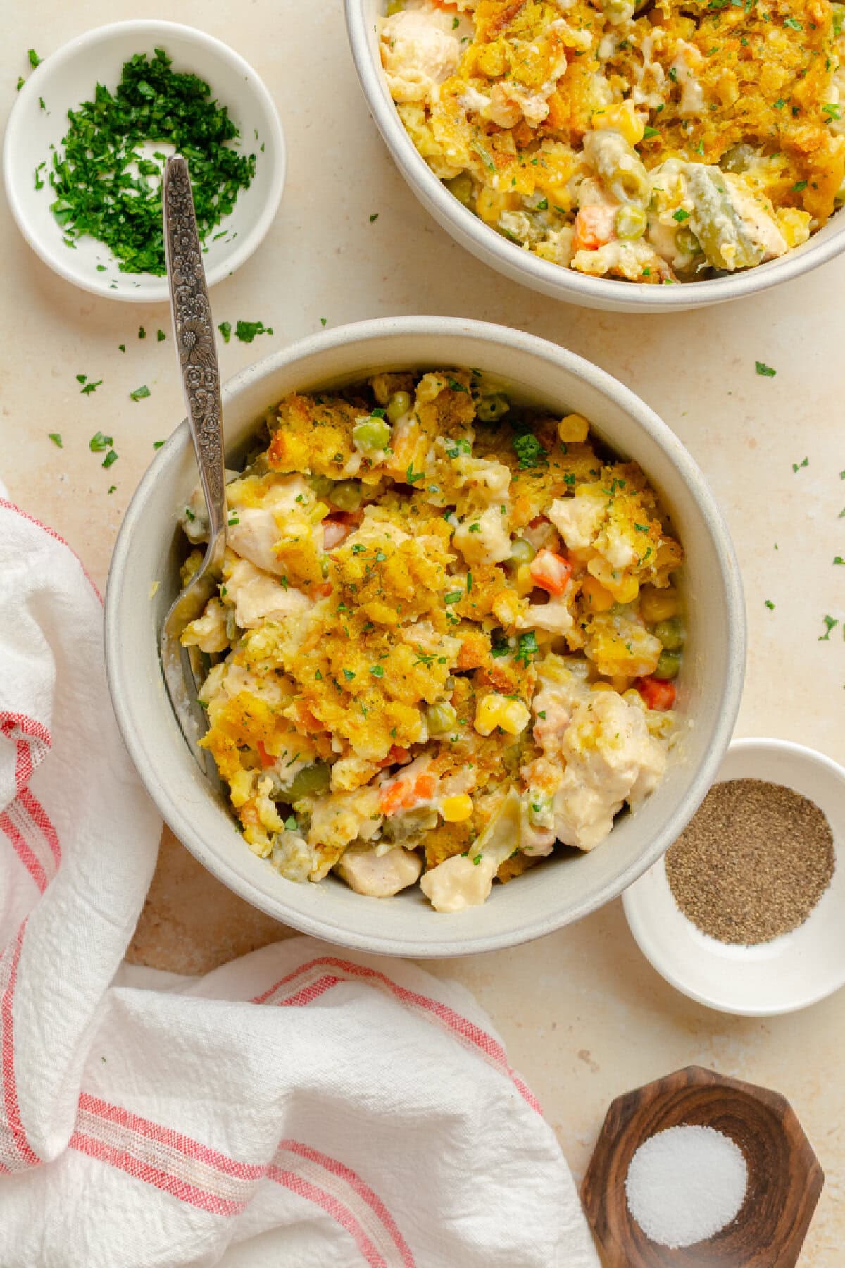 A serving of Chicken Stuffing Casserole in a bowl with a fork.
