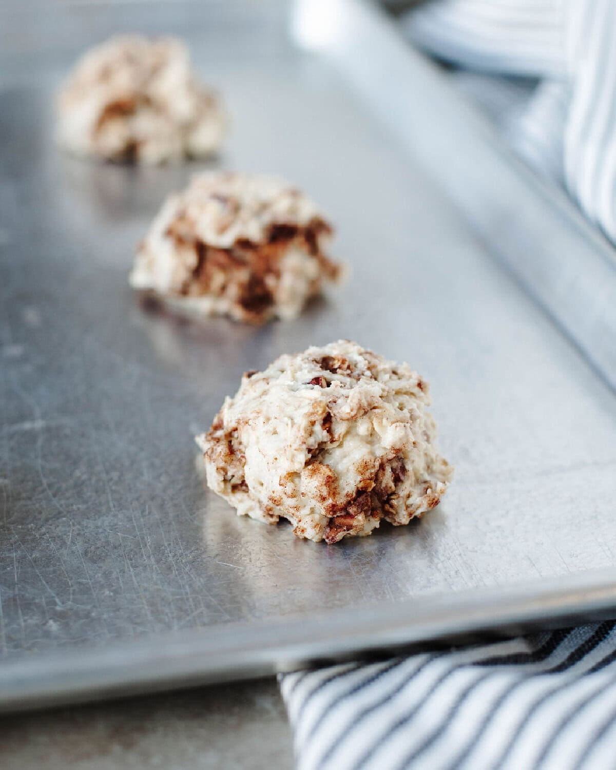 cinnamon drop scones on a baking sheet ready for the oven.