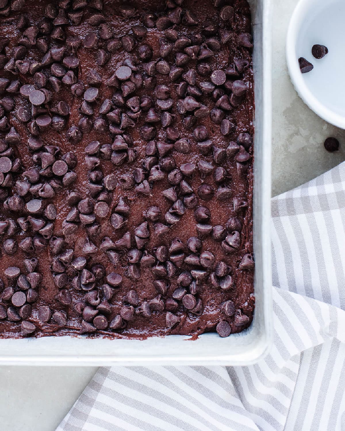 chocolate chips sprinkled over cake batter.