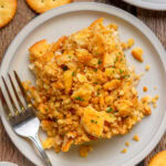 Close-up of creamy ritzy chicken casserole with buttery cracker topping.
