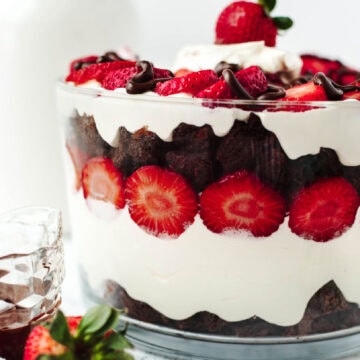 Strawberry brownie trifle in a glass bowl ready to serve.