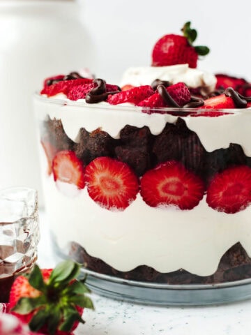 Strawberry brownie trifle in a glass bowl ready to serve.