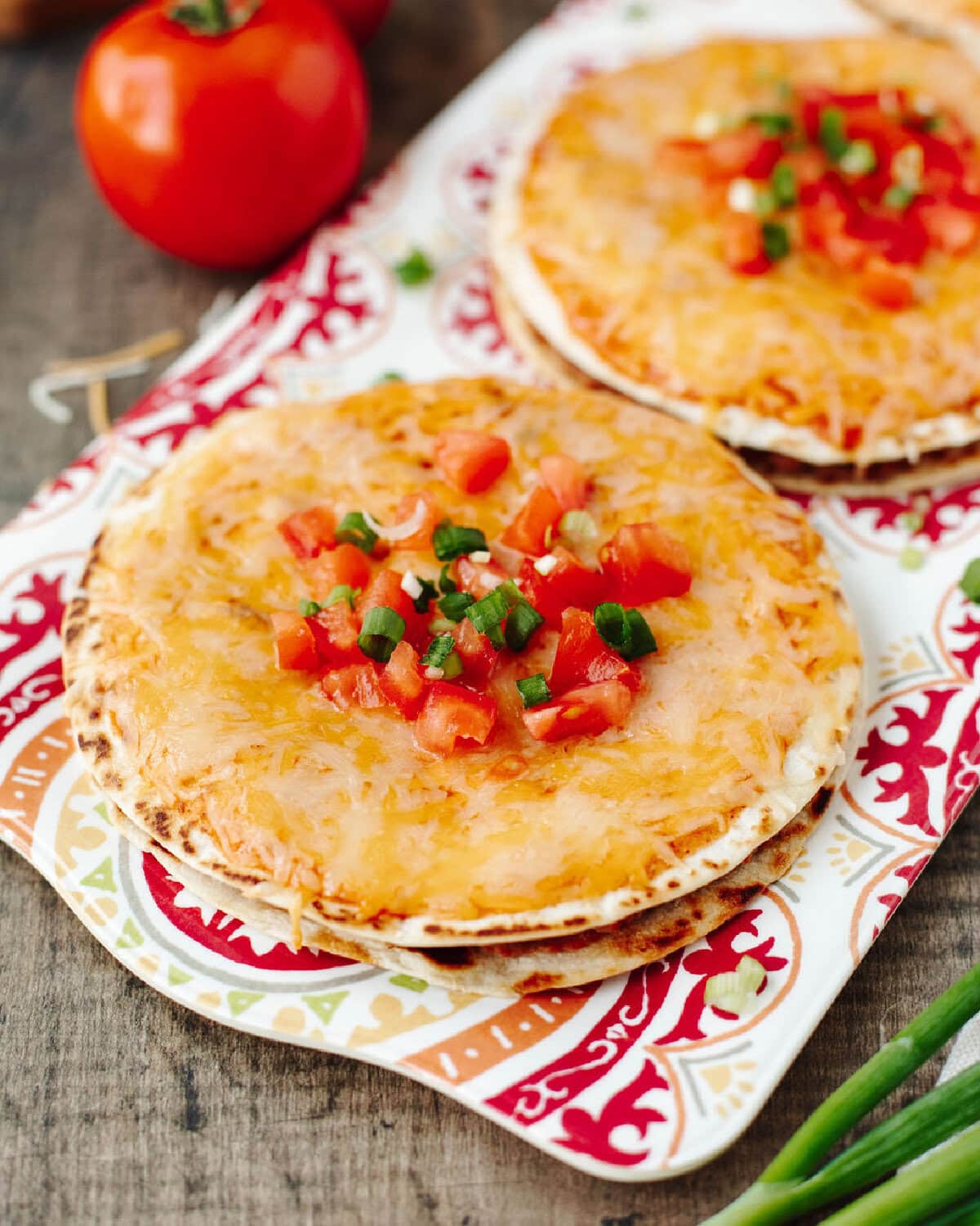 Copycat Taco Bell Mexican Pizza with crispy tortillas, red sauce, and melted cheese on a serving plate.