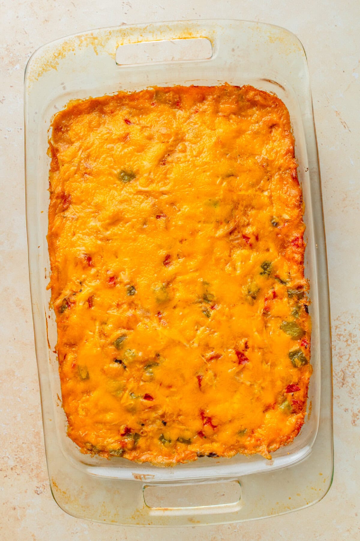 baked old-fashioned rotel chicken casserole with melted cheese on top.