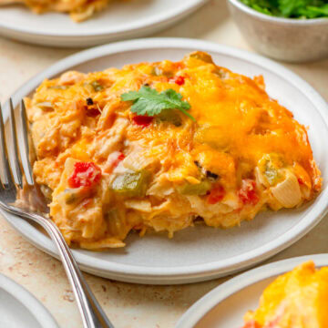 A serving of King Ranch Chicken Casserole on a white plate.