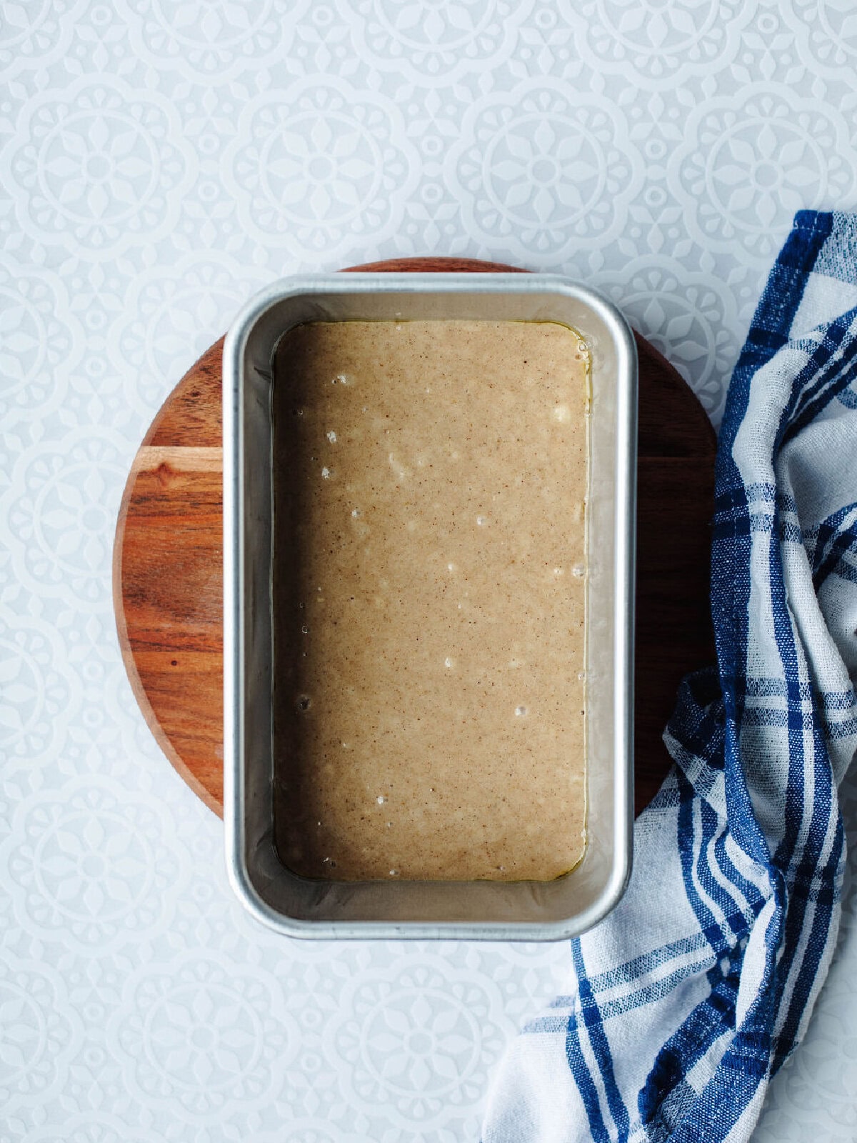 Banana bread batter in loaf pan before baking.