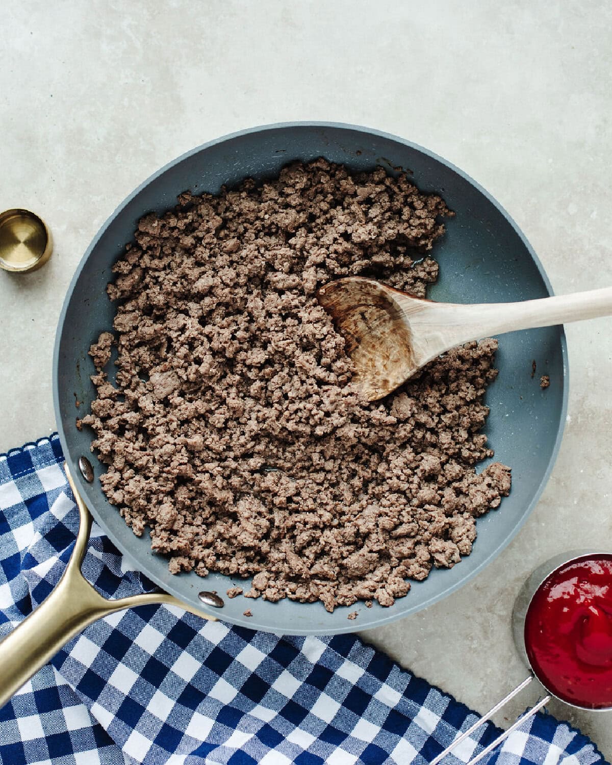 Ground beef cooked in a skillet.