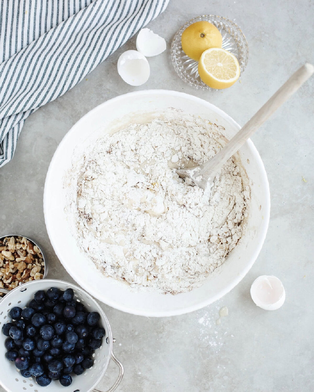 Flour, oats, salt, baking powder, cinnamon, and lemon zest folded into bread batter.