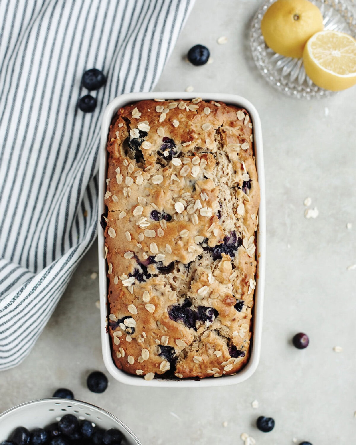 A baked loaf of blueberry lemon oatmeal bread.