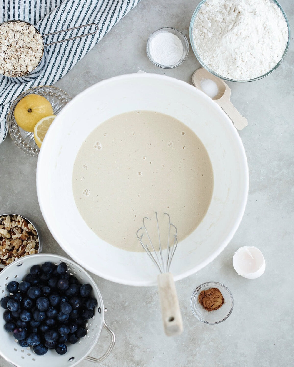 Brown sugar, eggs, sour cream, milk, vanilla, and coconut oil combined in a mixing bowl.