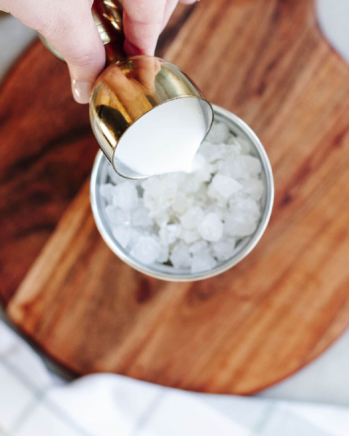 Half and half poured into a cocktail shaker over ice.