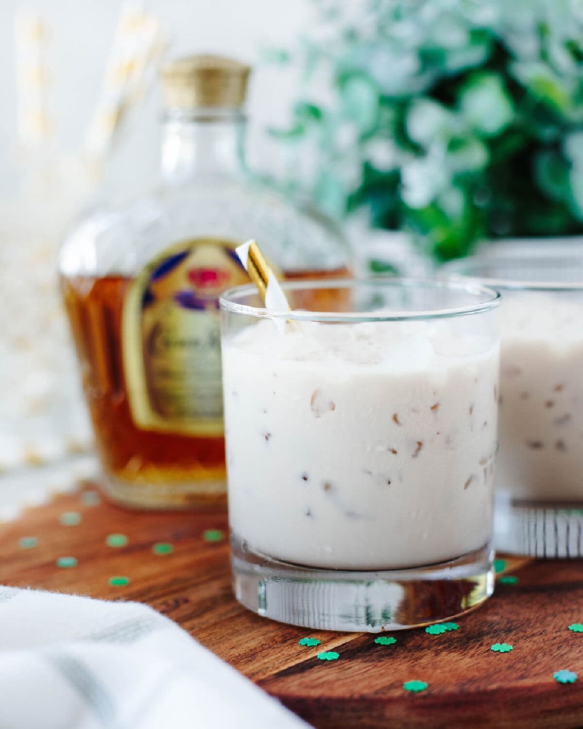 Kahlua White Leprechaun cocktails on a wood serving board ready to enjoy.