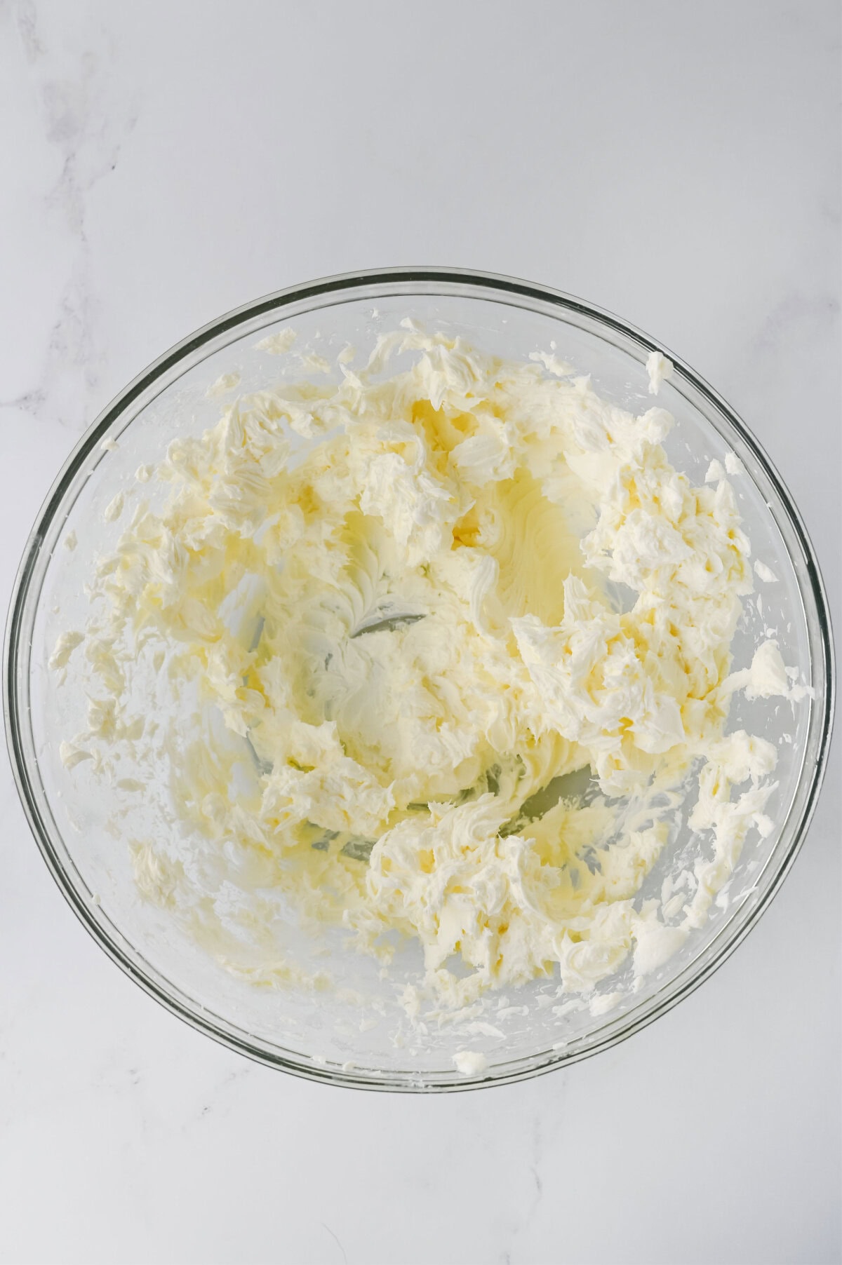 Lemon juice added into a cream cheese mixture.