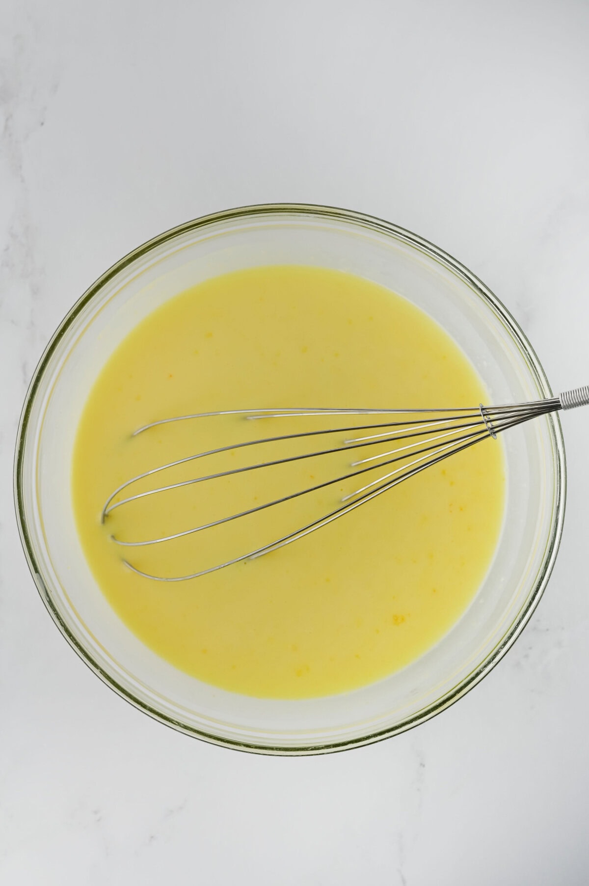 whisking lemon pudding mix with milk.
