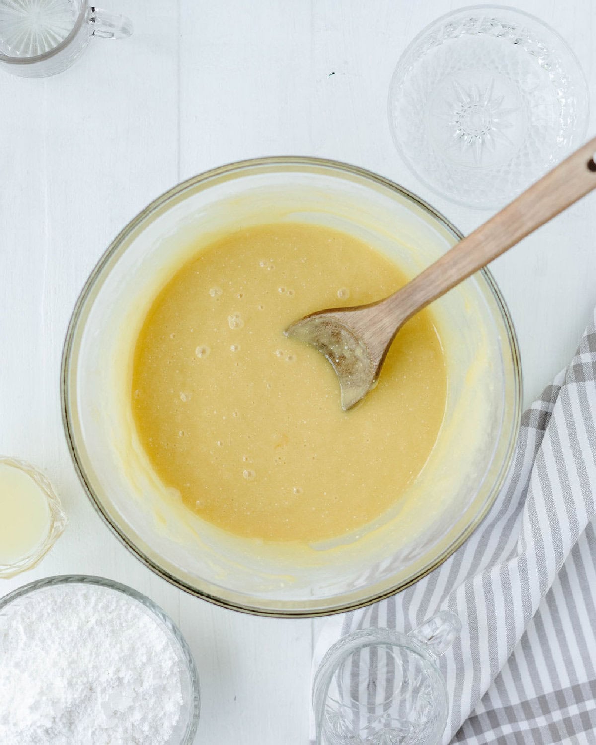Lemon cake batter prepared in a glass mixing bowl.