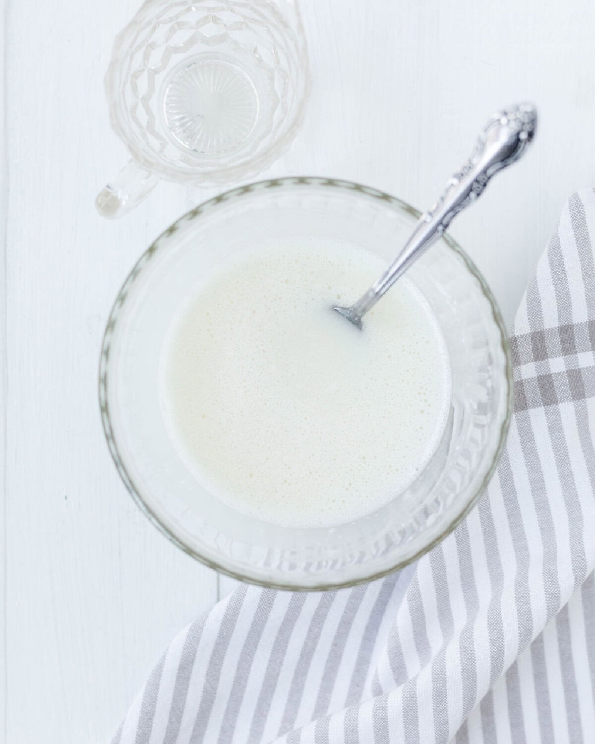 Lemon juice and powdered sugar combined in a small glass bowl.