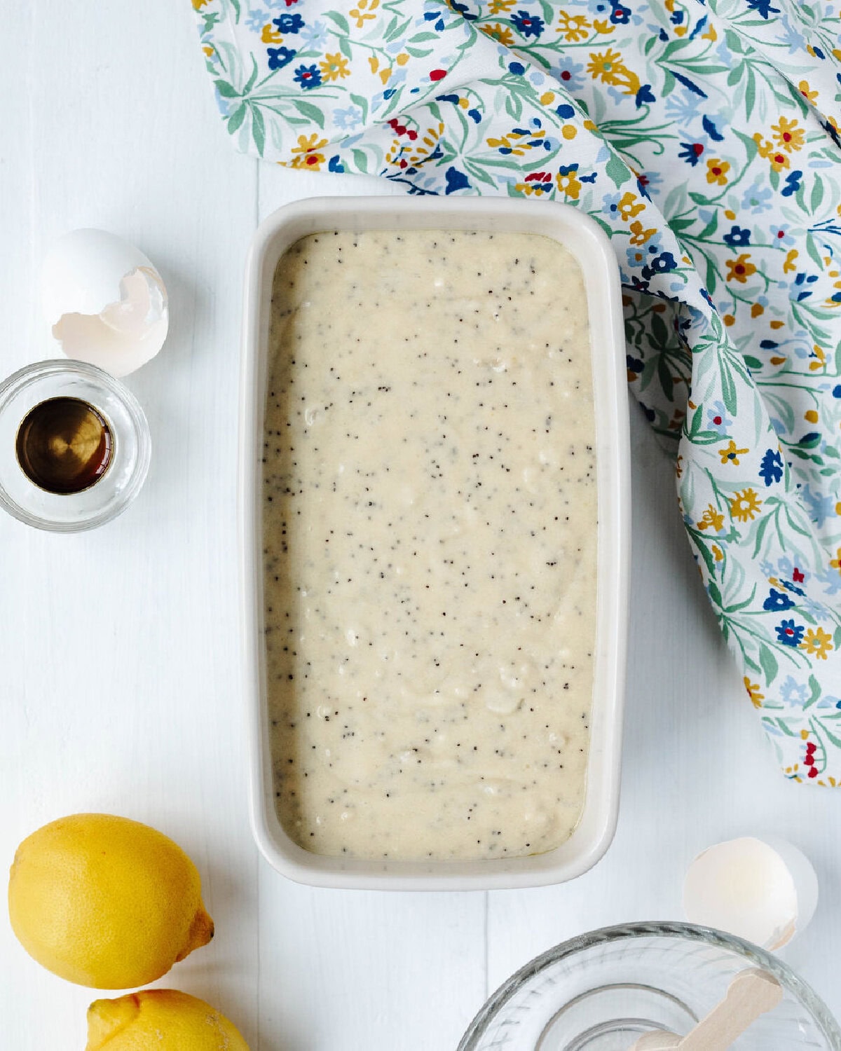 Lemon poppyseed batter spread evenly into a greased loaf pan.