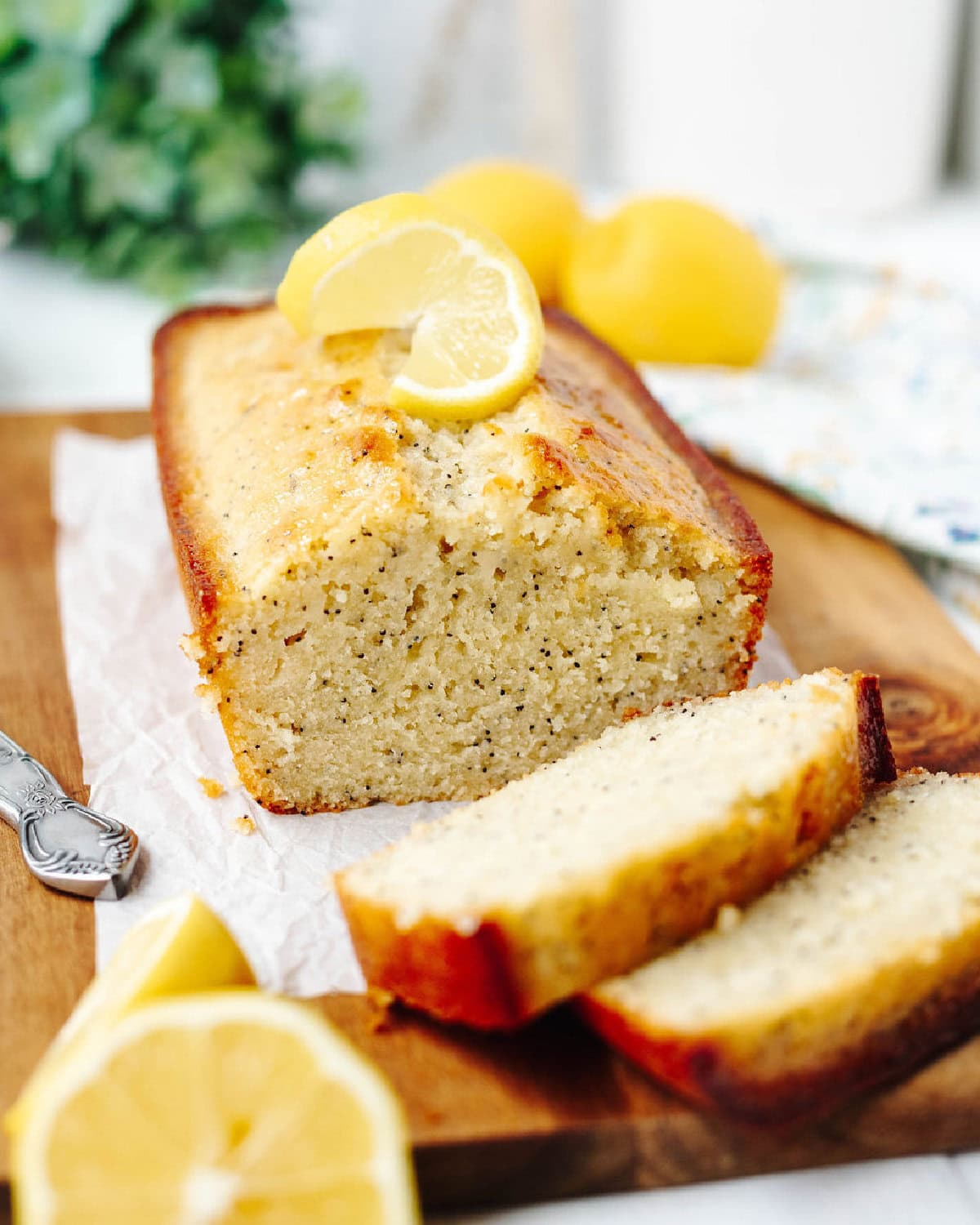 sliced lemon poppyseed bread loaf showing soft crumb.