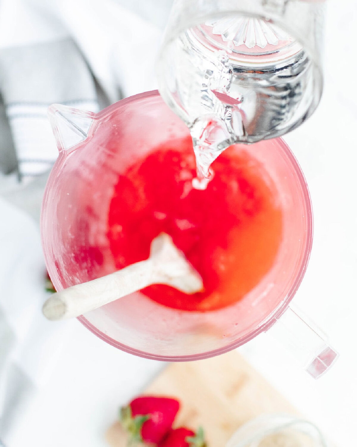 Malibu rum added into a large pitcher.