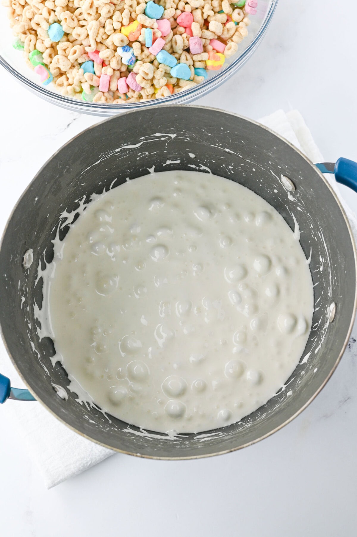 Marshmallows melted in a pot with butter.