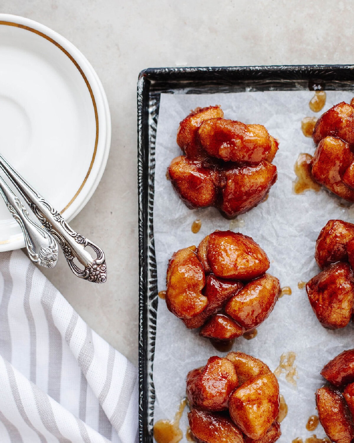 easy monkey bread muffins baked in muffin pan with caramel glaze.