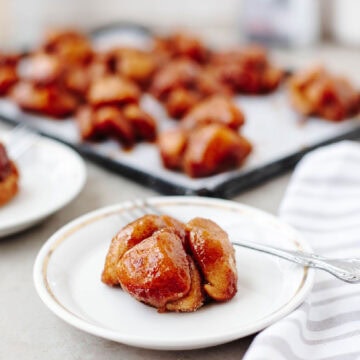 monkey bread muffins made in muffin tin with biscuits and cinnamon sugar glaze.