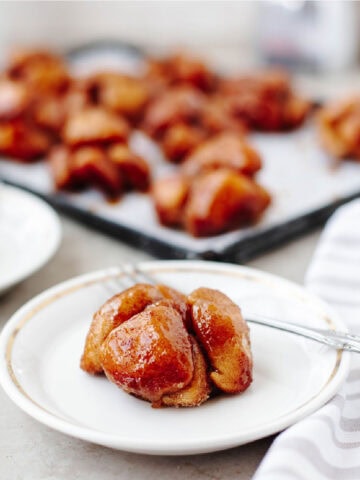 monkey bread muffins made in muffin tin with biscuits and cinnamon sugar glaze.