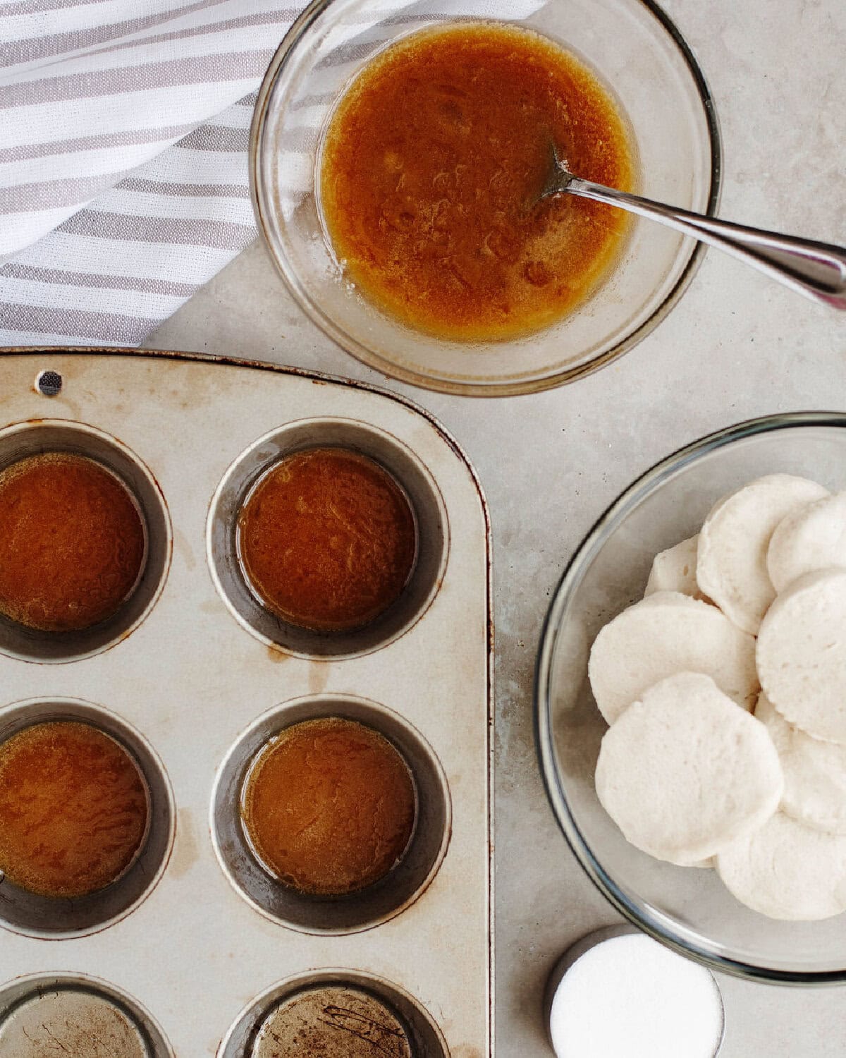 butter and brown sugar combined in a bowl and scooped into muffin tins.