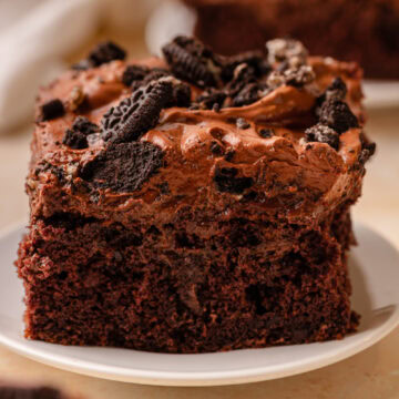 A slice of Oreo Dirt Cake on a white dessert plate.