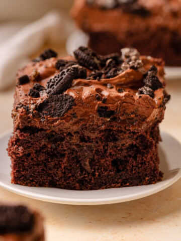 A slice of Oreo Dirt Cake on a white dessert plate.