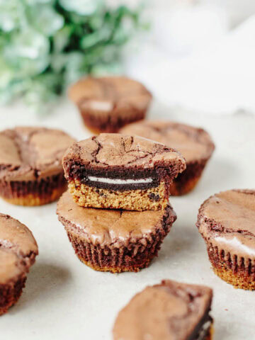 Stacked slutty brownie cups ready to serve.