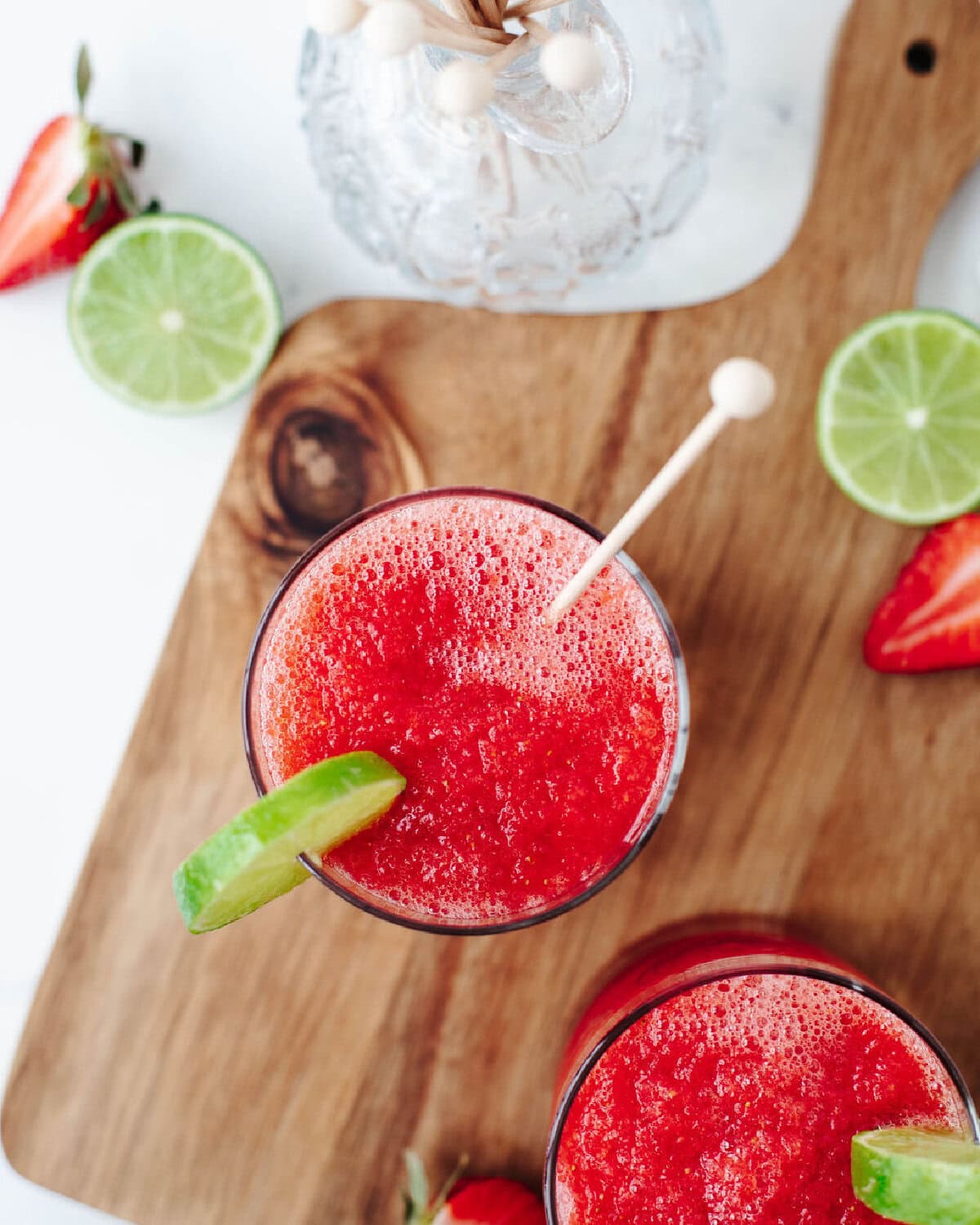 A strawberry coconut daiquiri blended and served in a cocktail glass.