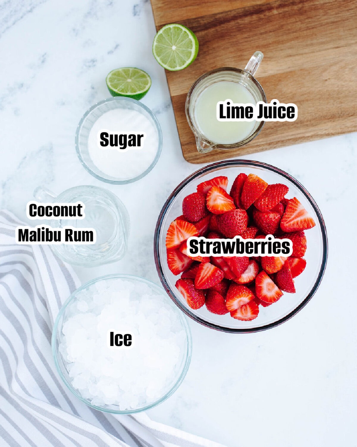 All the ingredients needed to make Strawberry Coconut Daiquiri.
