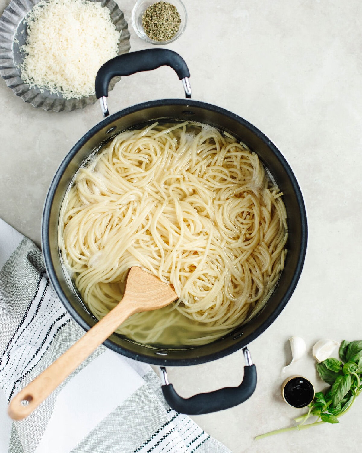Spaghetti pasta cooking in a pot with boiling water.