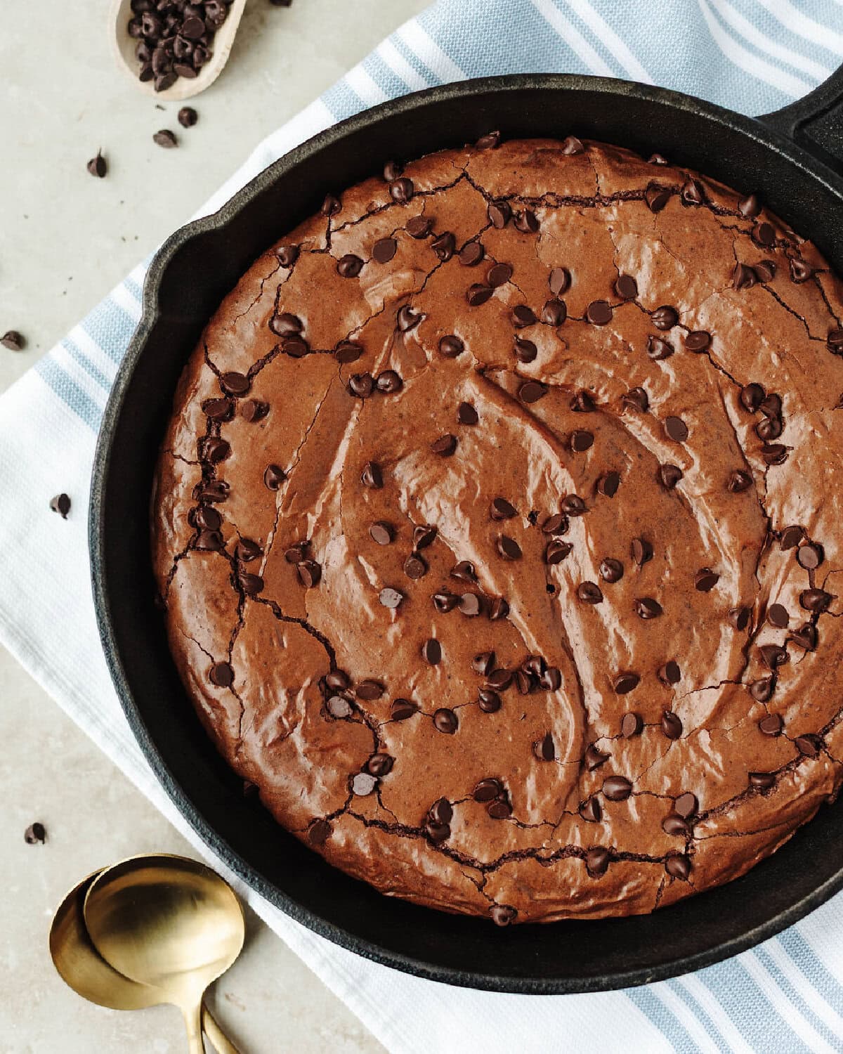 Baked brownies in a cast iron skillet ready to serve.