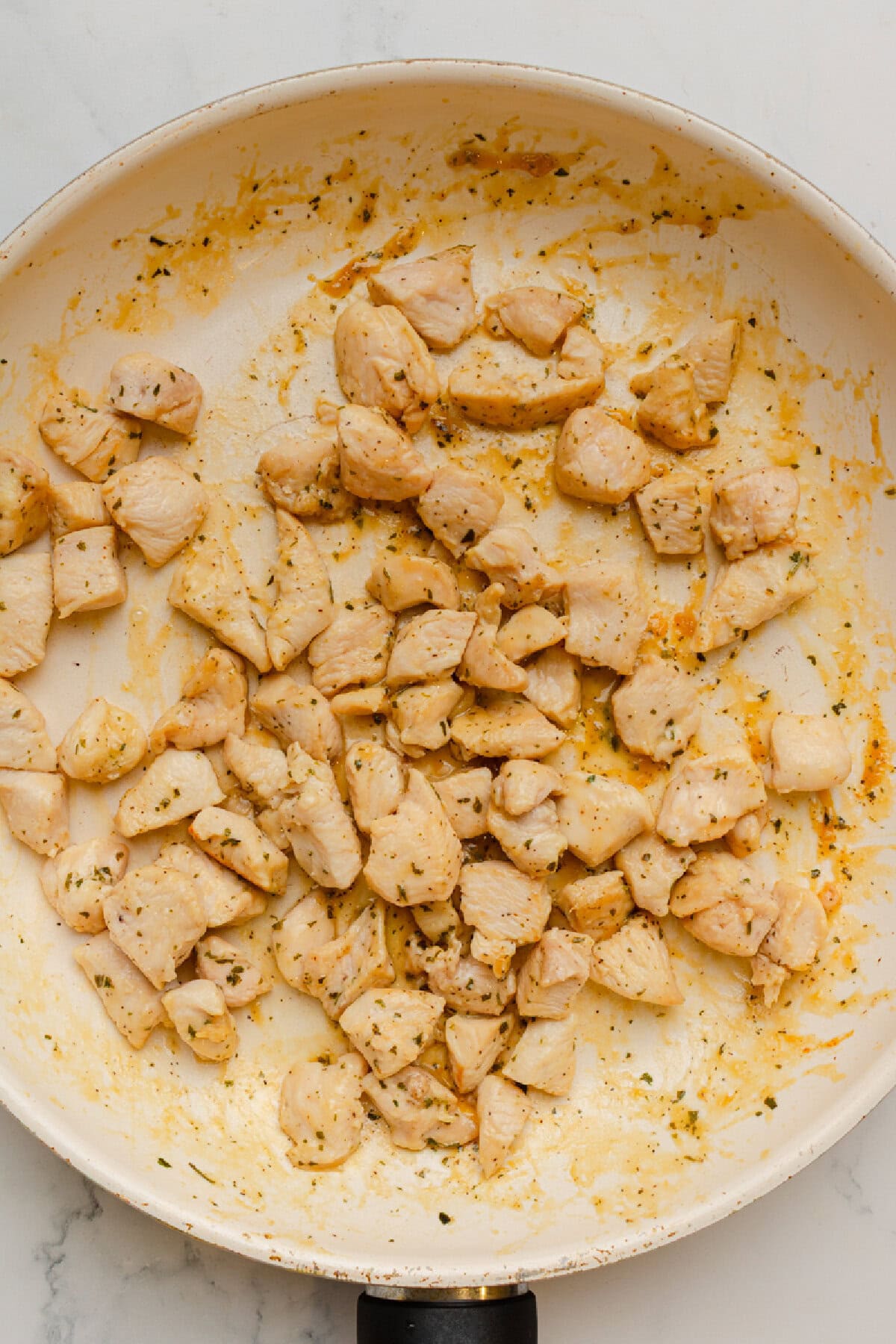 Diced chicken cooked in a skillet with Ranch seasoning.