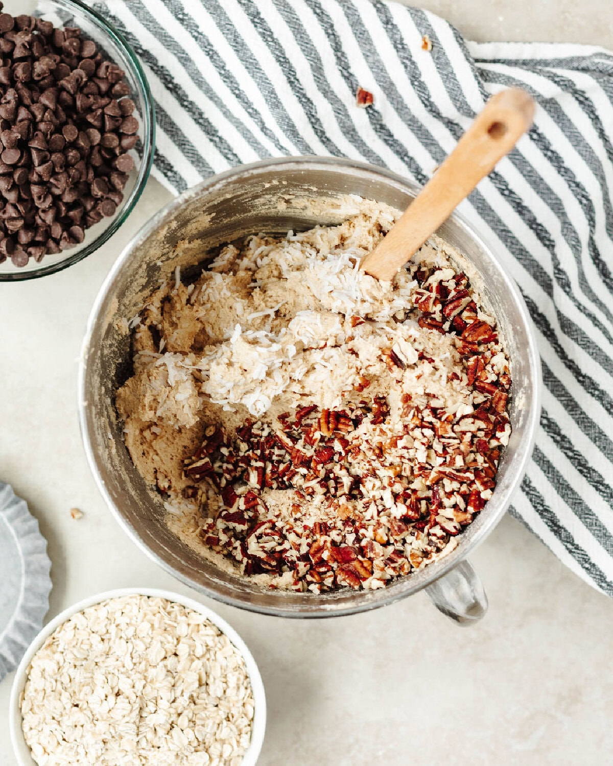 Chopped pecans, rolled oats, and shredded coconut folded into cookie dough.