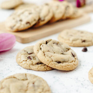 Baked chocolate chip cookies stacked and ready to enjoy.