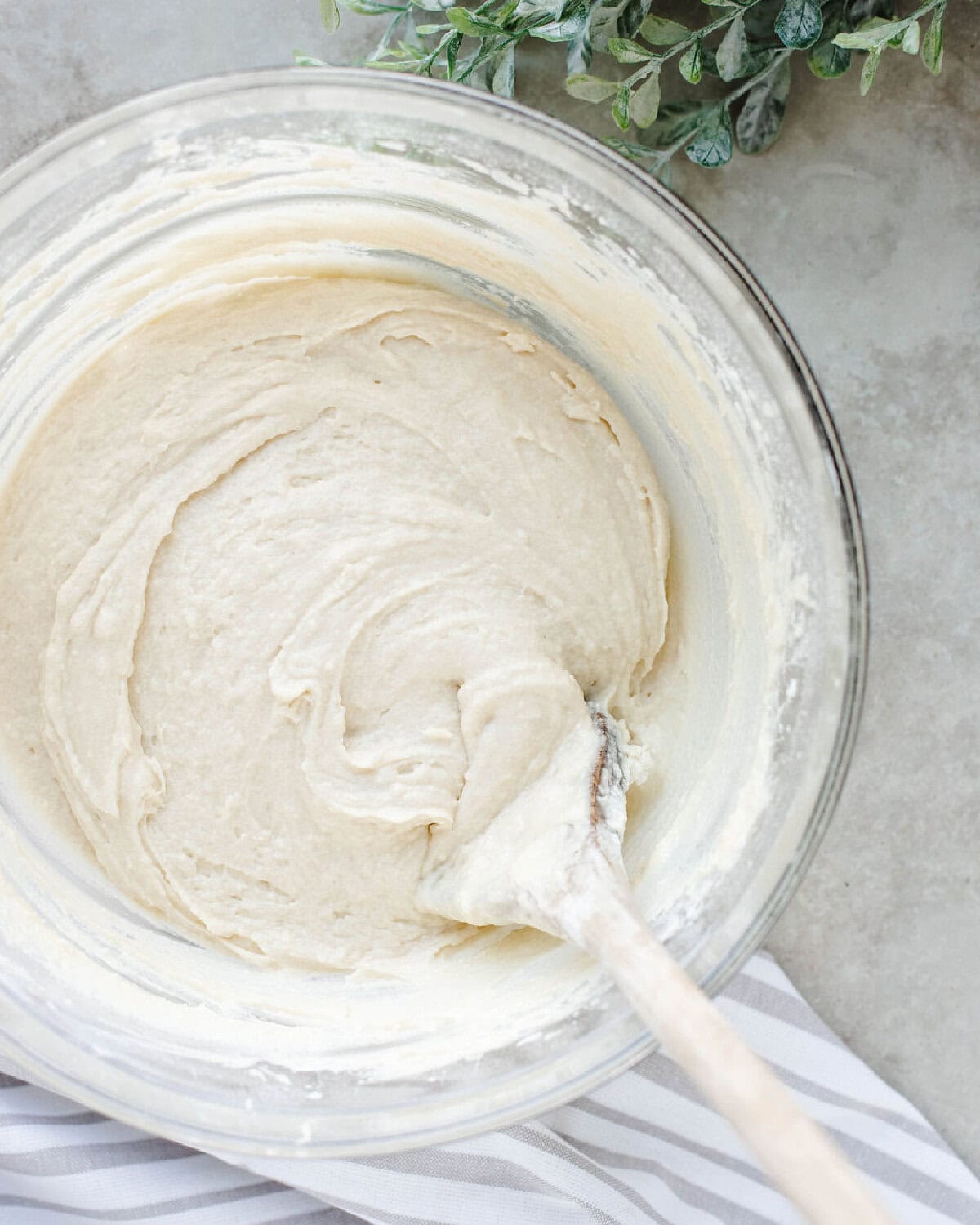 Coffee cake batter combined in a glass mixing bowl.