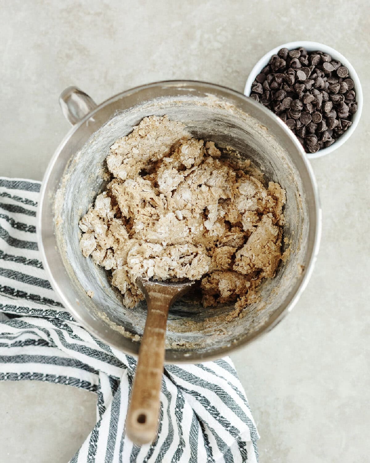 Flour, oats, baking soda, and salt added into a creamed butter mixture.