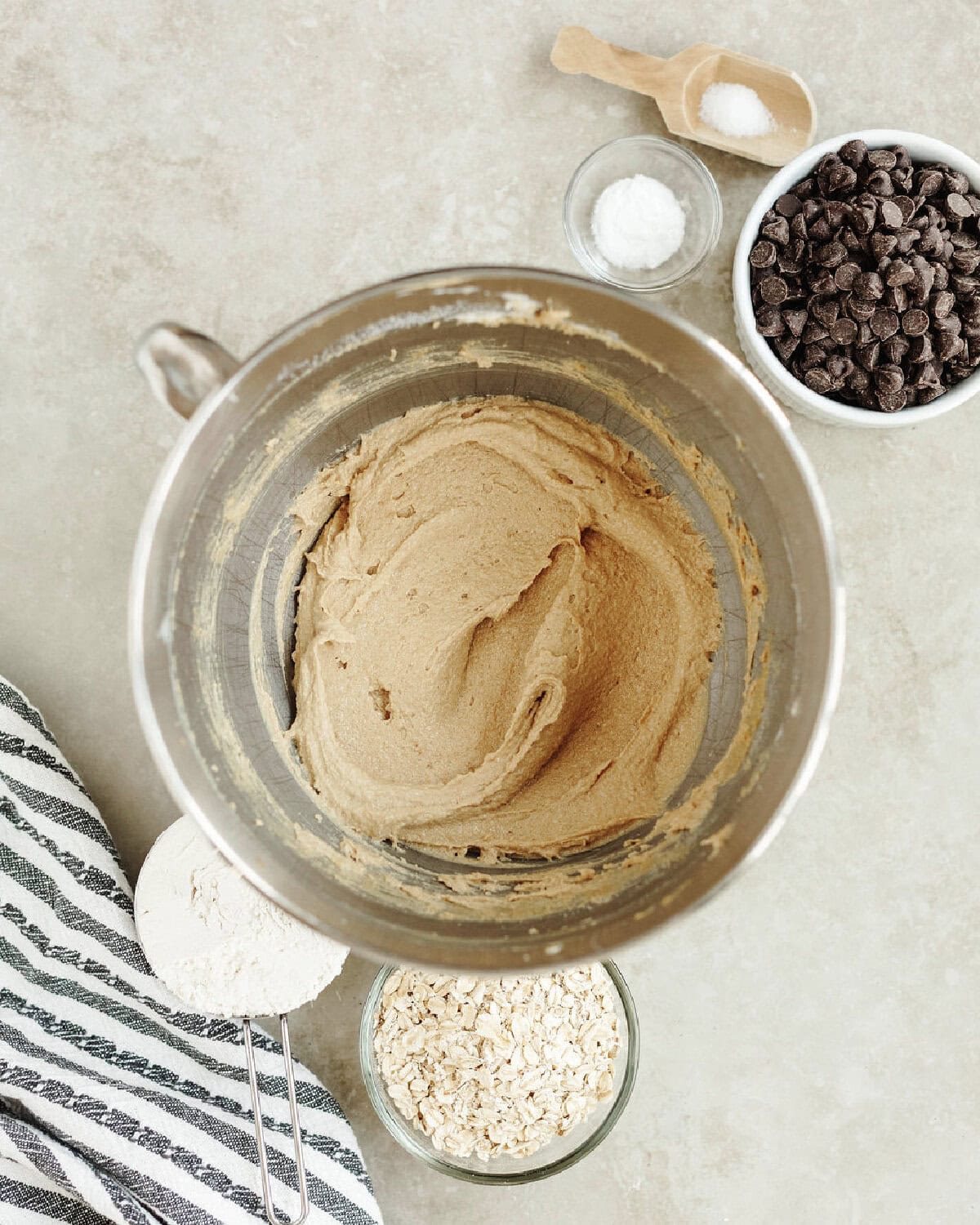 Creamed butter, peanut butter, and sugars in a mixing bowl.