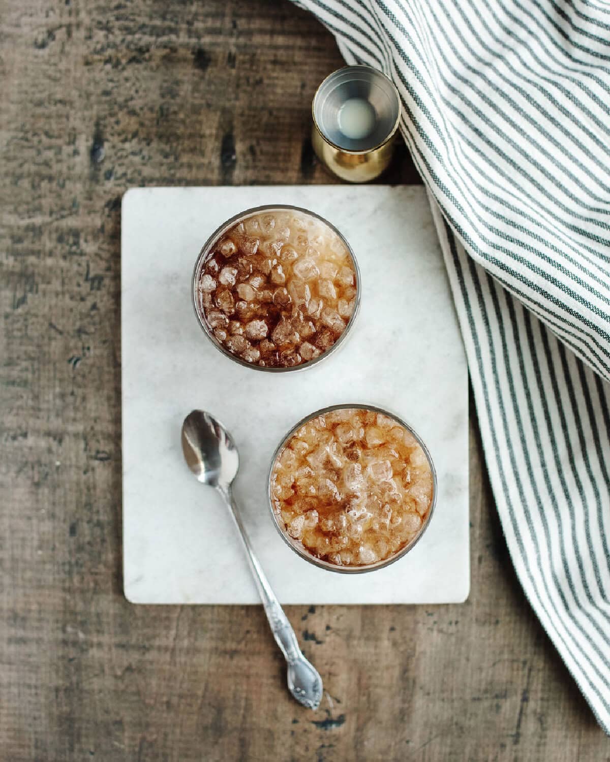 Creamy root beer drink with foam on top.