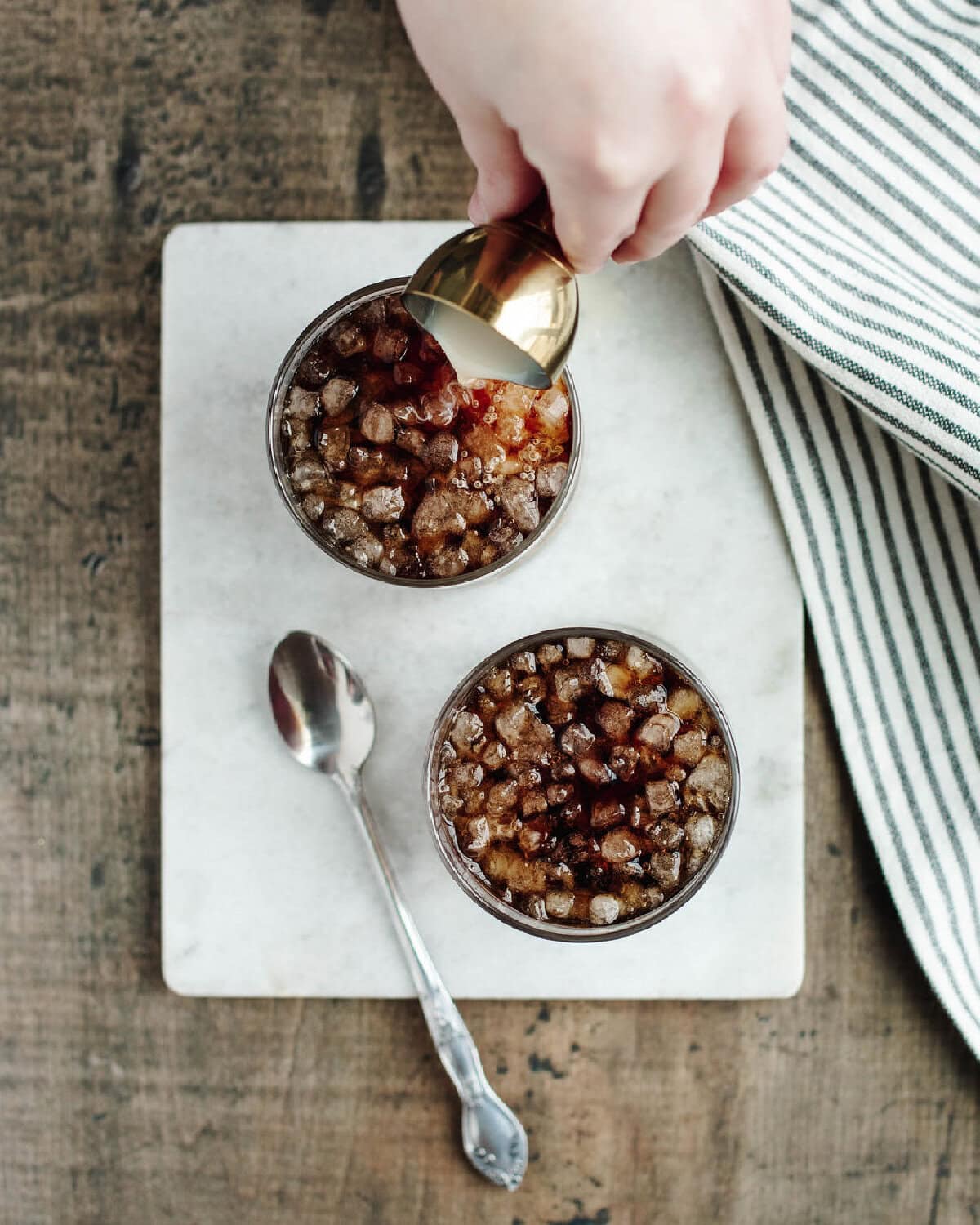 Adding RumChata to a fizzy drink.