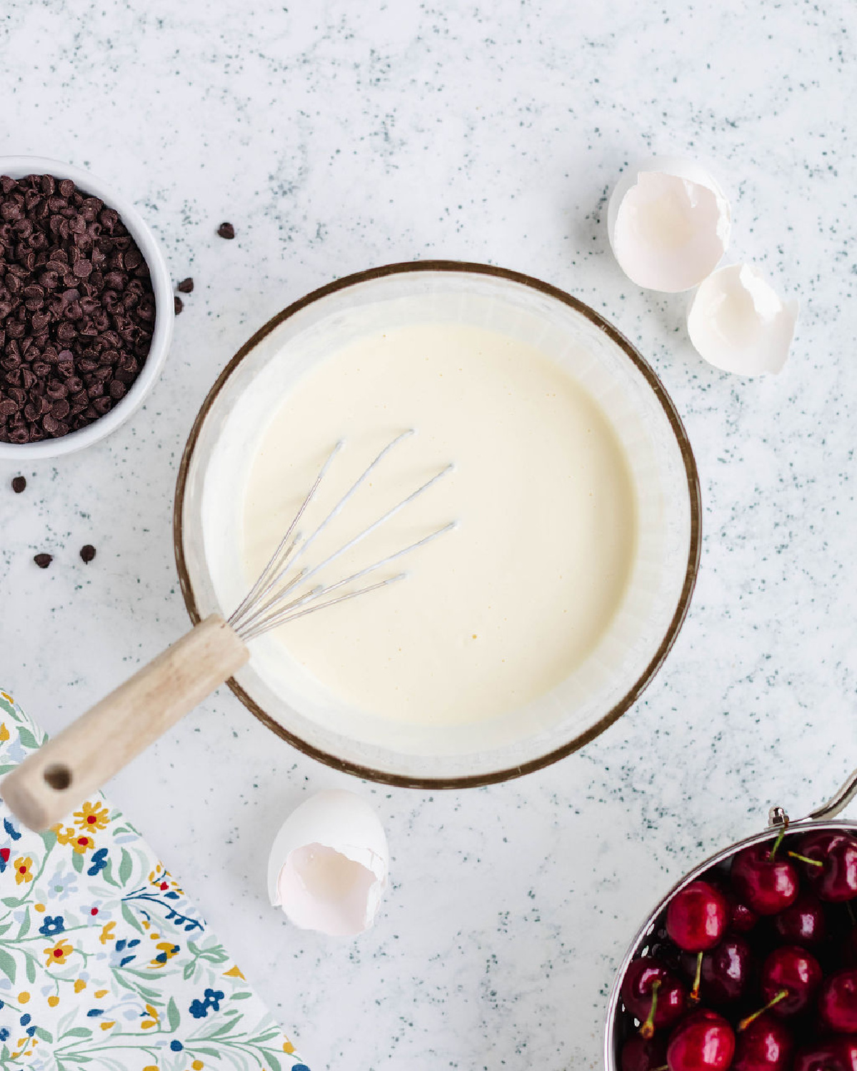 Whisked sour cream, buttermilk, vegetable oil, eggs, and vanilla in a mixing bowl.