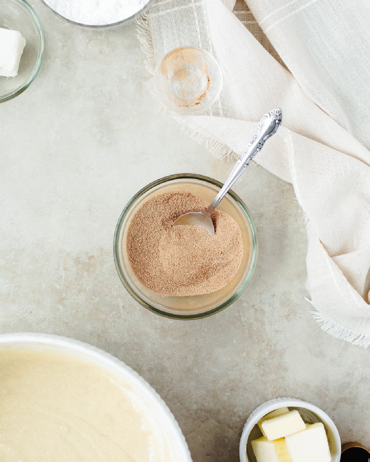 Cinnamon and sugar combined in a small glass bowl.