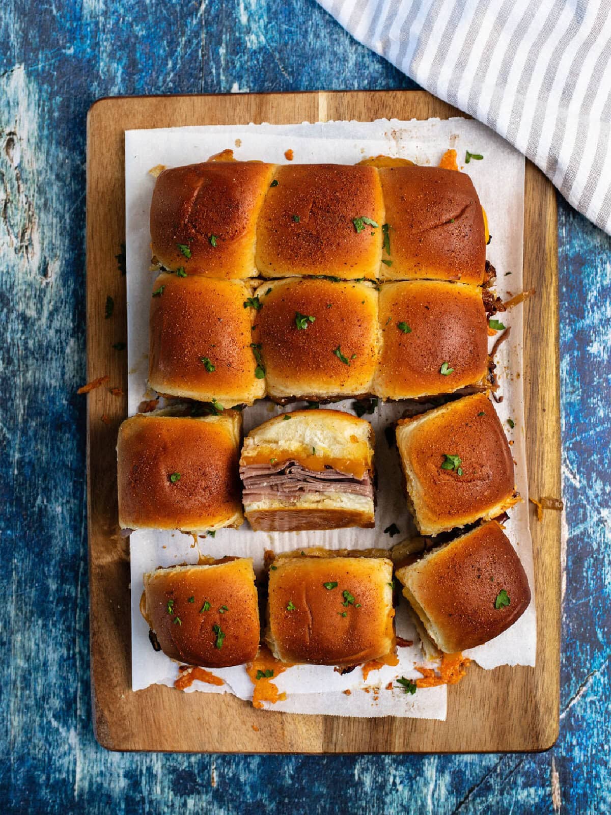 A top look at mini sandwiches with a roast beef and onion filling.