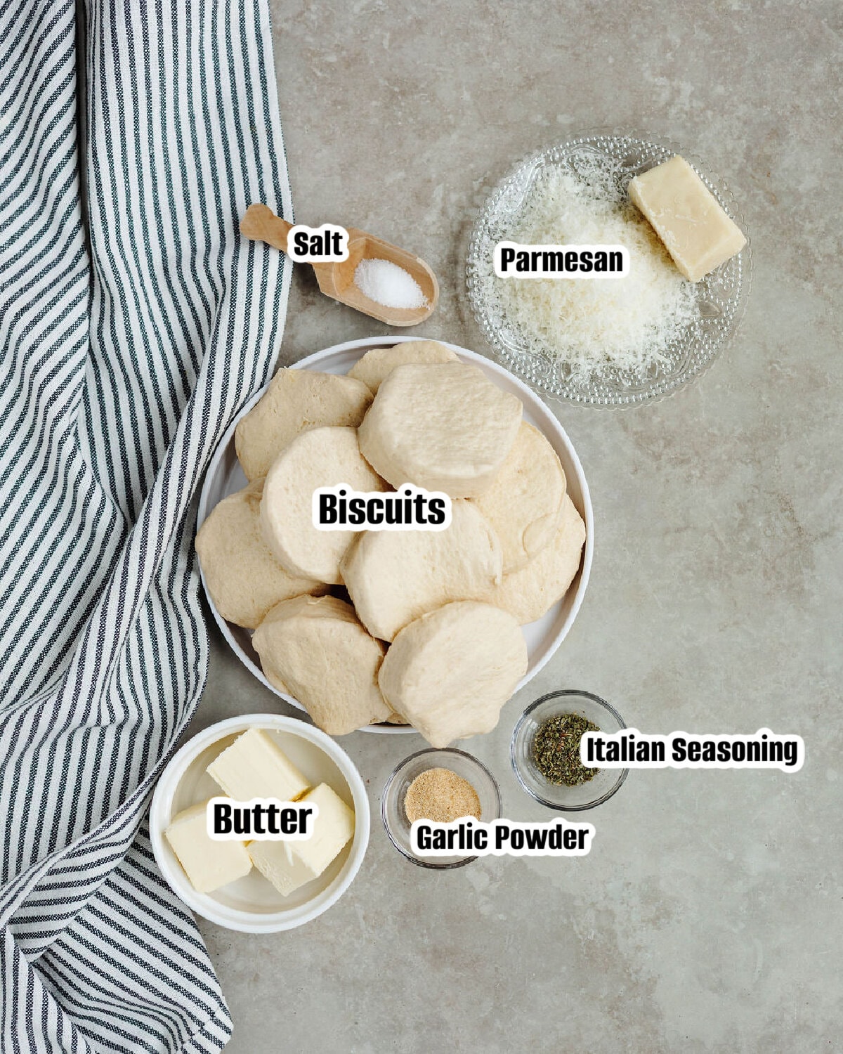 All the ingredients needed to make garlic pull apart bread using biscuits.