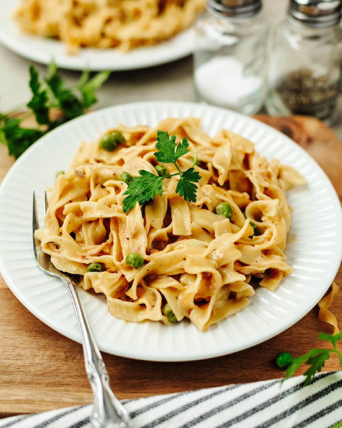 Creamy tuna casserole served on a white plate.