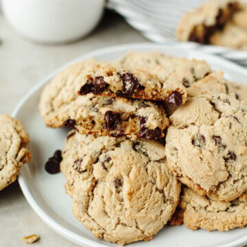 A close up look at Magnolia Table Chocolate Chip Cookies showing an ooey gooey chocolate chip center.